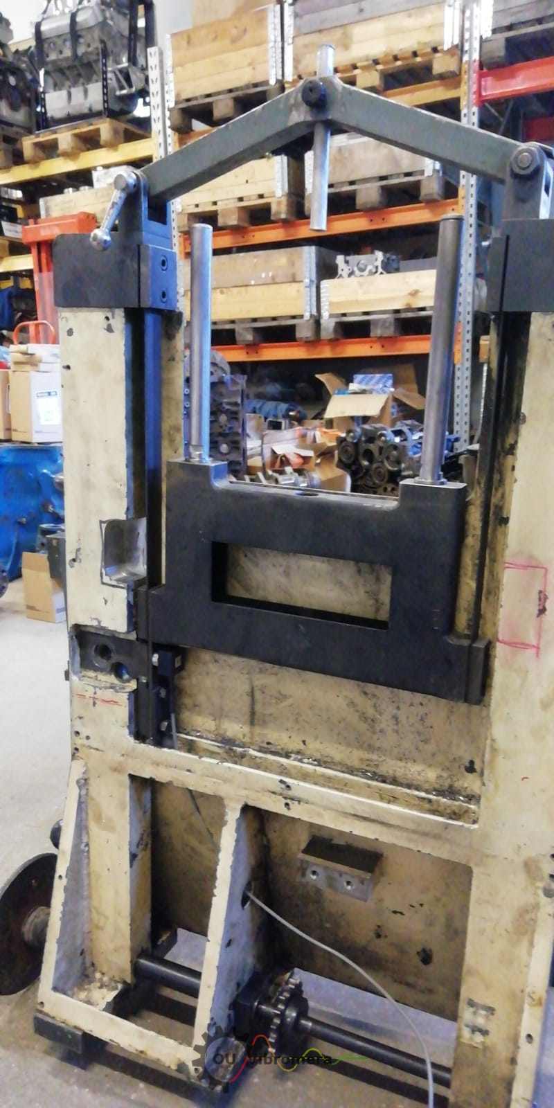 Vista lateral do suporte de rolo, mostrando o estado dos rolos.